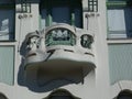 Secessionist style facade detail with balcony and green window