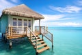 seclude overwater bungalow with private deck and steps into sea Royalty Free Stock Photo