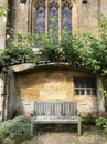 Secluded bench under archway by ancient church