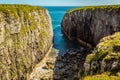 Secluded inlet between limestone cliffs near St Govans Head on the Pembrokeshire coast