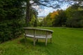 Secluded park bench in Batsford Arboretum.