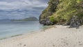 A secluded sandy beach on a tropical island. Royalty Free Stock Photo