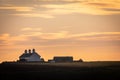 Secluded terraced houses on coastline with beautiful sunset sky