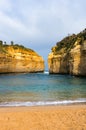 Secluded tropical beach with mild waves and sand shore Royalty Free Stock Photo