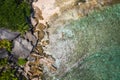 Secluded tropical exotic beach in deep jungle, coconut palm trees as and rocky coast Royalty Free Stock Photo