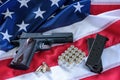 The second amendment and gun control in the US, concept. A handgun, magazines, bullets, and the american constitution on the USA f Royalty Free Stock Photo