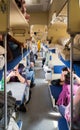 Second-class carriage with passengers in the Russian train. Long distance trains Royalty Free Stock Photo