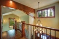 Second floor landing features stained handrails