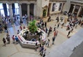 Second floor view of the lobby, people, and visitor center at The MET