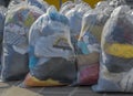 Second-hand clothes in plastic bags Royalty Free Stock Photo
