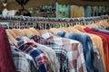 Second hand fashion store, closeup of    shirts hanging  on hangers Royalty Free Stock Photo