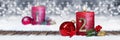 second sunday of advent red candle with golden metal number one on wooden planks in snow front of panorama bokeh background Royalty Free Stock Photo