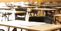 Secondary High School college hall set up with student exam examination papers ready to sit