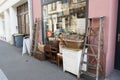 Secondhand store called brocante in French with vintage goods exhibited outside on the street.