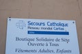 Secours catholique caritas france logo sign and brand text solidarity shop of non-