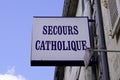 Secours catholique france logo sign and brand text of french Rescue Catholic help