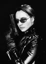 Secret agent woman with gun Royalty Free Stock Photo