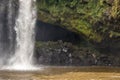 Secret Cave Behind Waterfall And Moss Covered Cliff Royalty Free Stock Photo