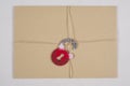 A secret envelope, a parcel bound with a rope, with symbolic lock. Open the lock.