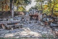 Secret gathering place - Large stone fireplace and rock table in clearing in woods in Autumn - selective focus