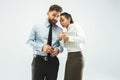 The young woman whispering a secret behind her hand over white background Royalty Free Stock Photo