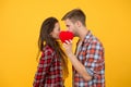 Secret kiss. Intimacy. Man and girl romantic date. Couple in love. Sexy couple checkered shirts. Heart full of love Royalty Free Stock Photo