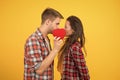 Secret kiss. Intimacy. Man and girl romantic date. Couple in love. Sexy couple checkered shirts. Heart full of love Royalty Free Stock Photo