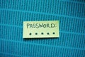 Secret password written on paper note on background. Login access, encryption and cyber security concepts Royalty Free Stock Photo