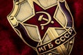 Secret service, intelligence agency, and espionage concept with macro close up on a cold war era KGB badge from the former USSR on Royalty Free Stock Photo