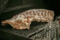 Raw pork ribs with salt, pepper and thyme ready for slow baking in the oven.