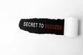Secret to success words on torn white paper
