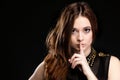 Secret woman. Girl showing hand silence sign Royalty Free Stock Photo