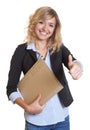 Secretary with blue blazer and file showing thumb up Royalty Free Stock Photo