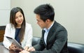 A secretary and boss is discussing about their project in meeting room Royalty Free Stock Photo