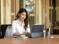 Secretary of executive manager checking her boss schedule on digital tablet Royalty Free Stock Photo