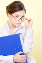 Secretary with eyeglasses holding file Royalty Free Stock Photo