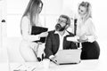 Secretary and manager. Office affair. Surrounded by beautiful ladies. Seductive colleague. Flirting with boss. Man and Royalty Free Stock Photo
