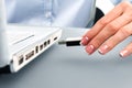 Secretary's hand inserts flash drive. Royalty Free Stock Photo