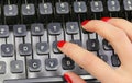 Secretary s red-polished fingernails typing on the keys of an old typewriter in an office Royalty Free Stock Photo