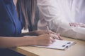 Secretary writing a note for job interview in meeting room Royalty Free Stock Photo