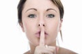 Secretive Young Woman with Finger on Lips