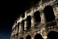 A section of the facade of the Colosseum Flavian Amphitheatre in Rome during the blue hour. Night view. Rome, Lazio, Italy Royalty Free Stock Photo