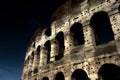 A section of the facade of the Colosseum Flavian Amphitheatre in Rome during the blue hour. Night view. Rome, Lazio, Italy Royalty Free Stock Photo