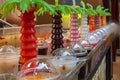 Section of freshly prepared juices from tropical fruits in shop-window counter Royalty Free Stock Photo