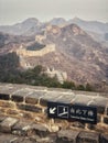 A section of the Great Wall of China at Jinshanling near Beijing in China. Hazy air polluted skies over the mountains. Royalty Free Stock Photo