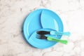 Section plate with fork and knife on marble table, top view. Serving baby food