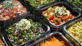 A section of premade salads including Caesar Greek and Asianinspired options for those on the go Royalty Free Stock Photo
