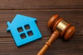 Section of property after a divorce or the purchase or sale of a home by auction. Blue house and gavel Royalty Free Stock Photo