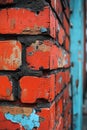 A section of red brick wall with blue paint applied in various patterns and designs Royalty Free Stock Photo