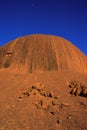 A section of the rock formation of Uluru Ayers Rock at sunrise, the moon in the background, Uluru-Kata Tjuta National Park ,